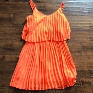 Neon orange pleated dress